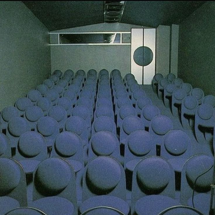 A depiction of an off-white shell placed delicately on a background of deep blue.